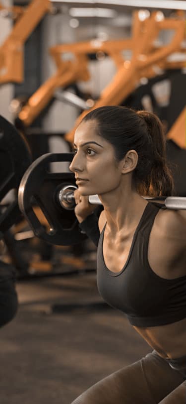 Woman lifting in a gym